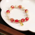Gold foil coloured glaze ethnic bracelet for women with geometric design and Xingshi elements