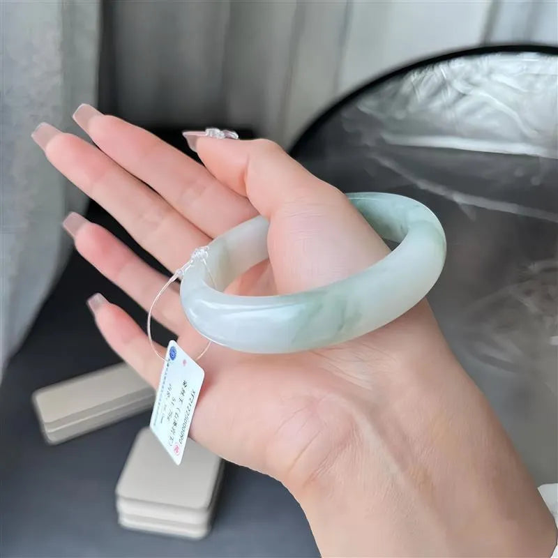 Tian Shan Cui children's bracelet with ice-like floating flowers and zodiac animal design.
