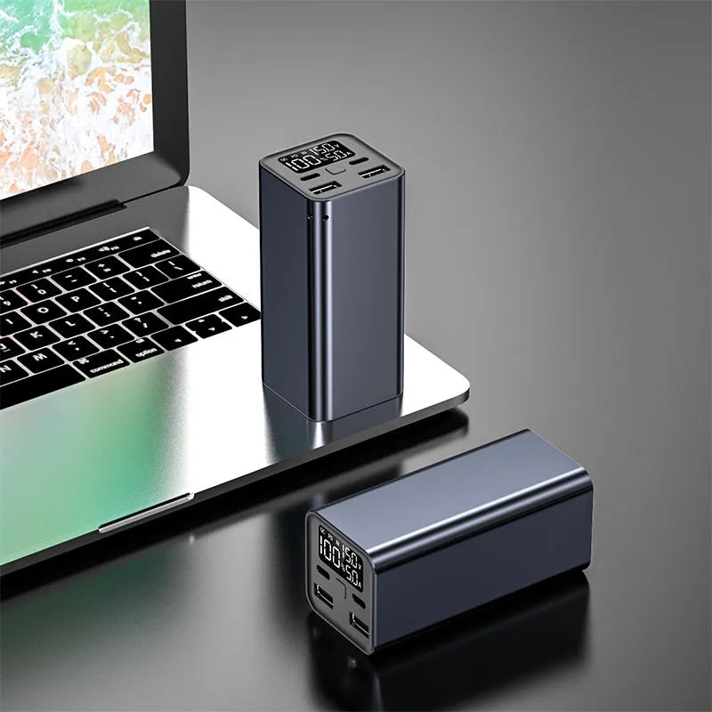 Black aluminium alloy 65W power bank with 20000mAh capacity for laptop charging, shown next to a charging cable.