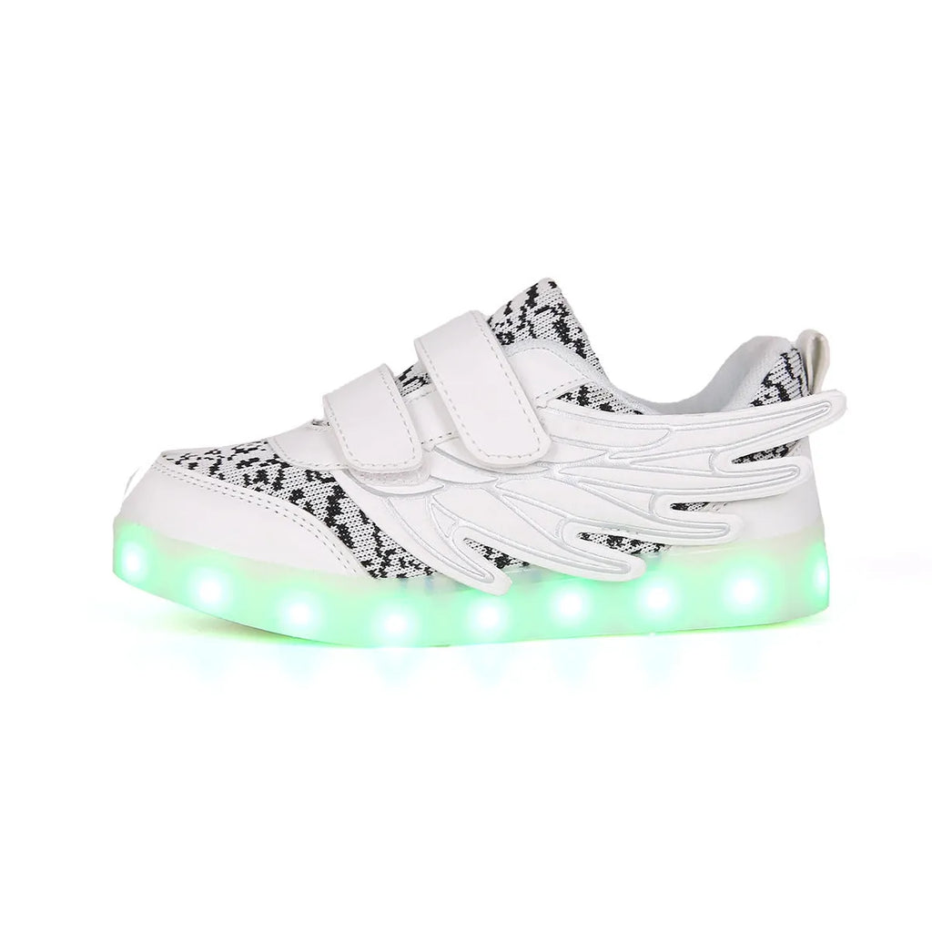 Children's plum red and white LED light-up sneakers with colourful winged lights, showing USB charging port.
