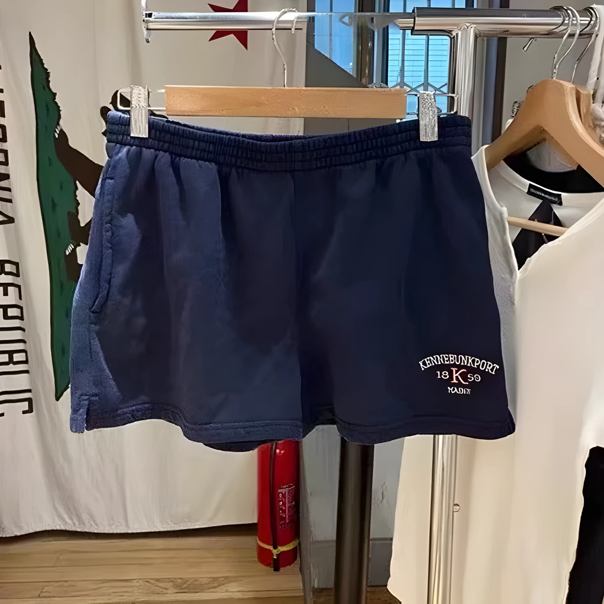 Dark blue women's cotton high top shorts with white flag embroidery detail