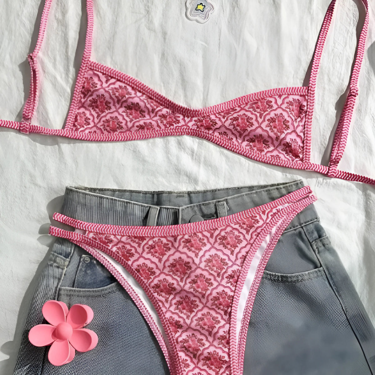 Pink printed two-piece swimsuit with shoulder straps and exposed back, top and shorts set, sizes S M L XL