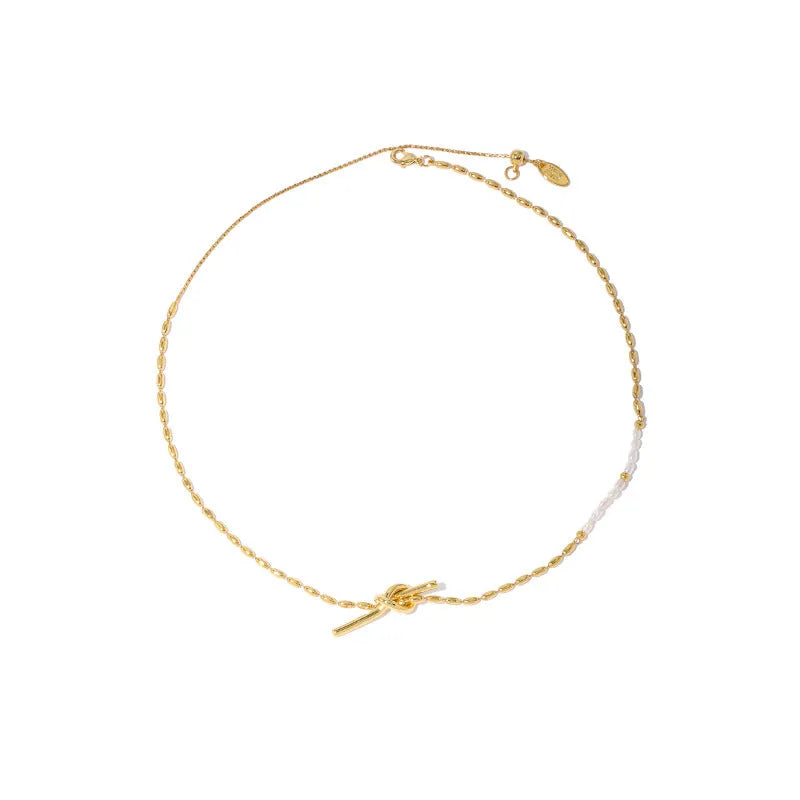 Gold electroplated natural real pearl necklace with copper geometric pendant and ring-line design on white background