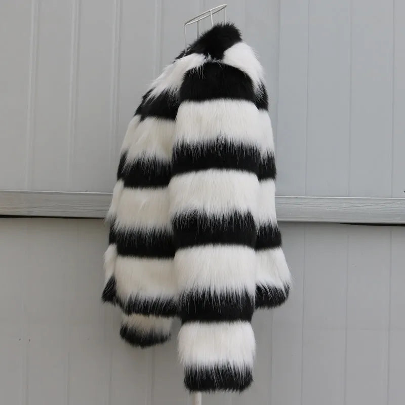 Black and white striped faux fur leather jacket for women, shown in a street fashion style.
