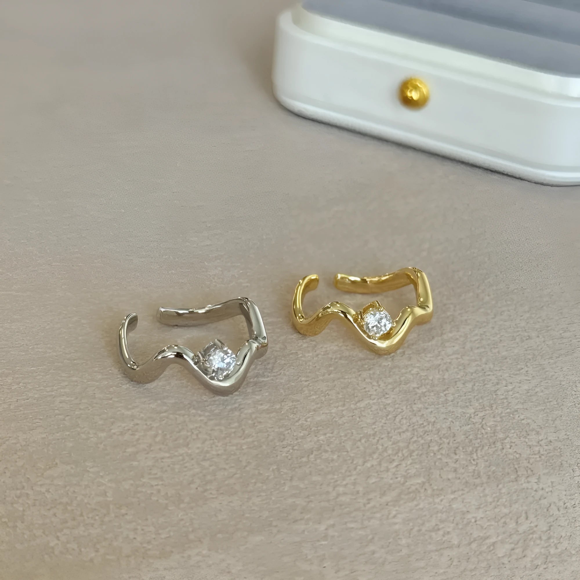 Women's silver electroplated open ring with single diamond and smooth wave line design, white gold tone