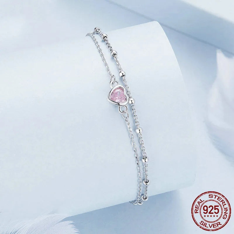 Women's sweet style 925 silver bracelet with small heart-shaped pendant on an adjustable chain.
