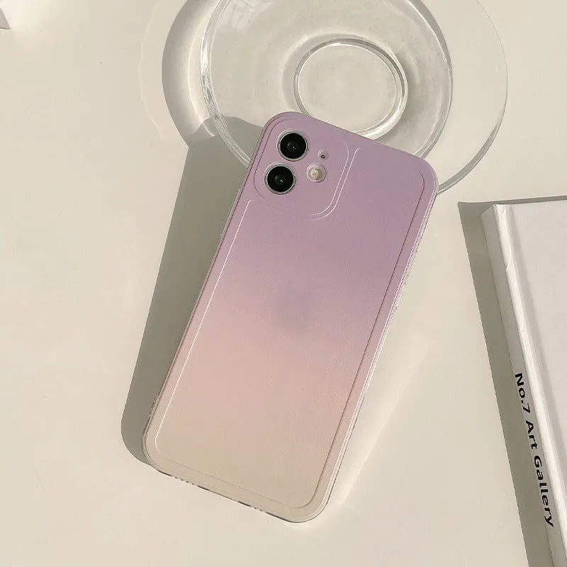Yellow to purple gradient silicone protective case for iPhone on a table