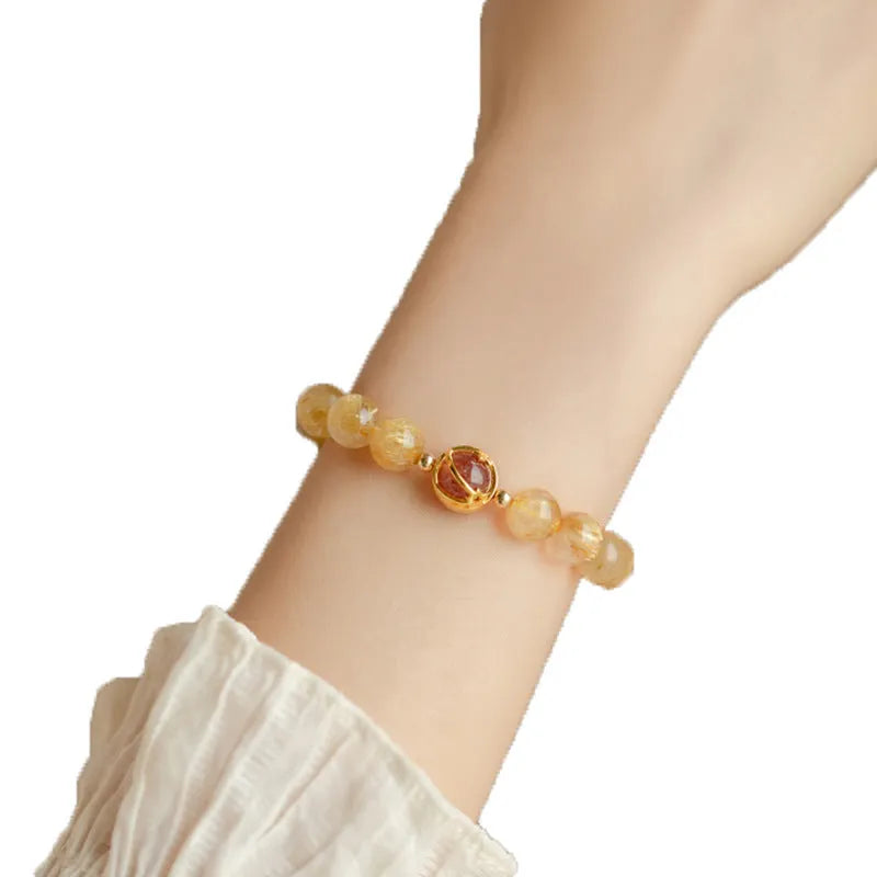 Gold rutilated quartz crystal bracelet with diamond shaped beads in Korean style design