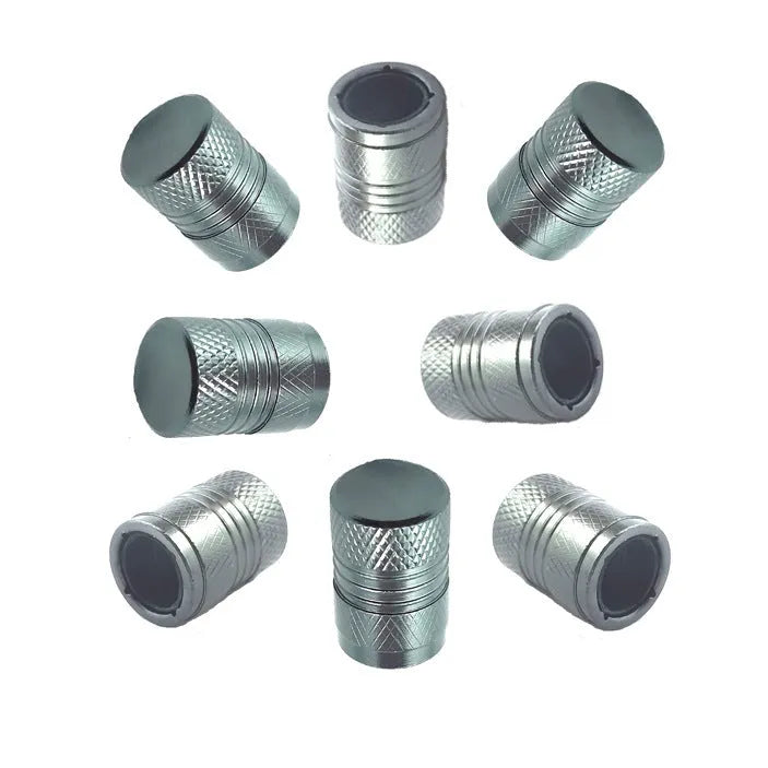 Aluminium car tyre valve cover in black, 17mm length, on a tyre valve stem