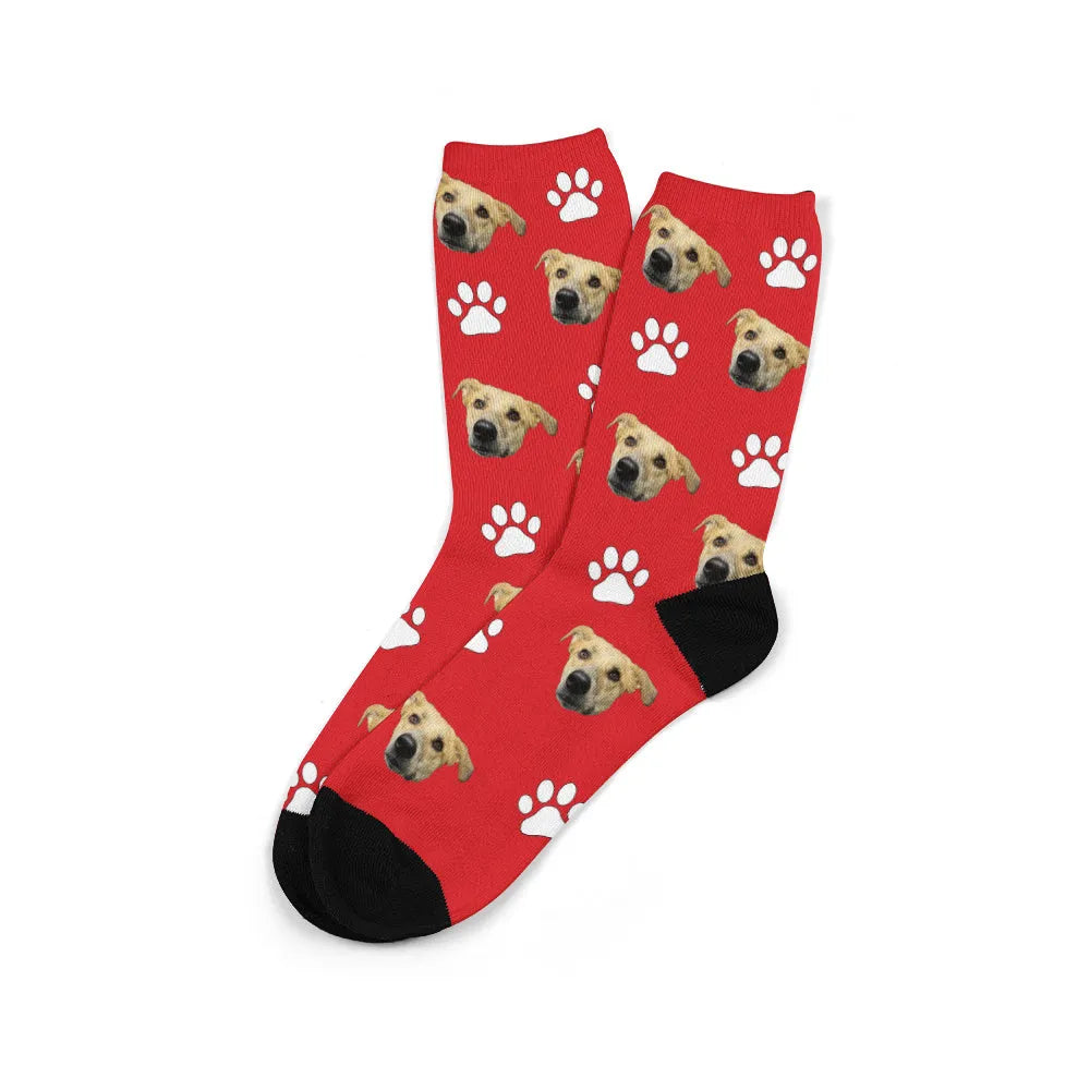 Custom cartoon graphic printed on a pair of coloured mid-calf tube socks made from polyester.