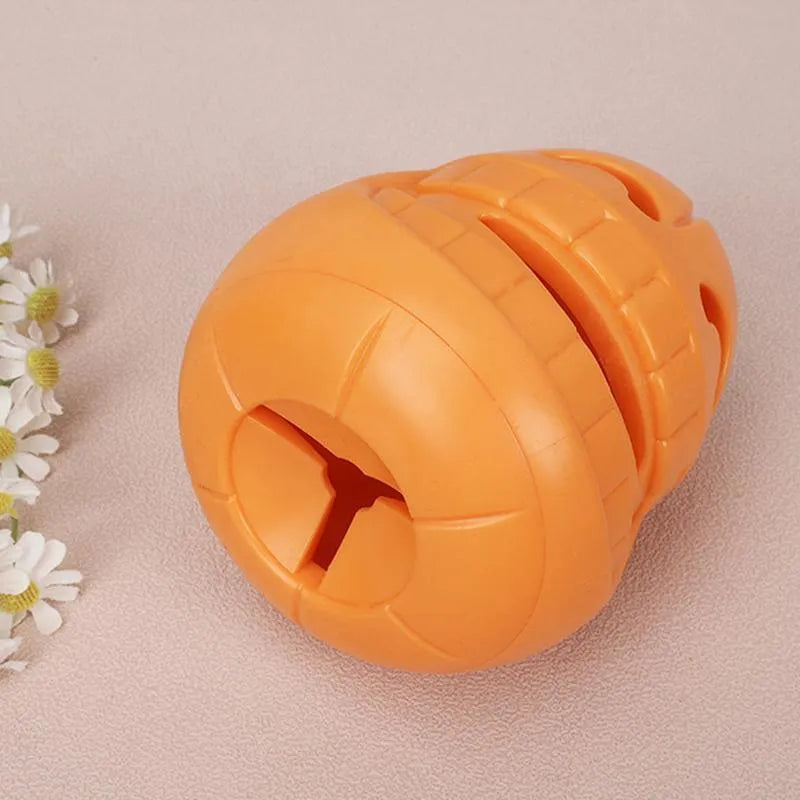 Yellow pumpkin-shaped TPR dog chew toy measuring 8.6x11.5cm