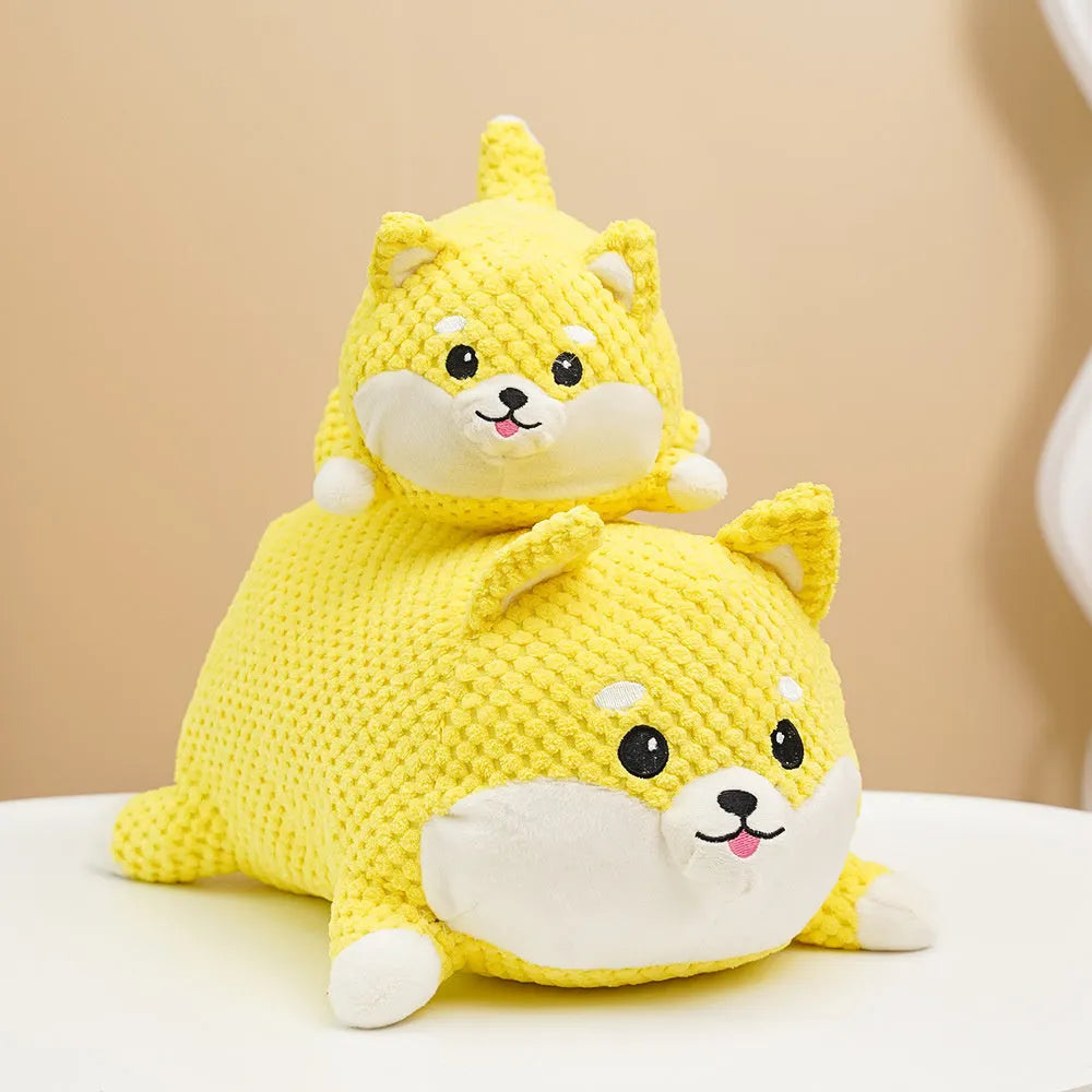 Plush calming dog toy with squeaker for chewing and anxiety relief, shown in large and medium sizes.