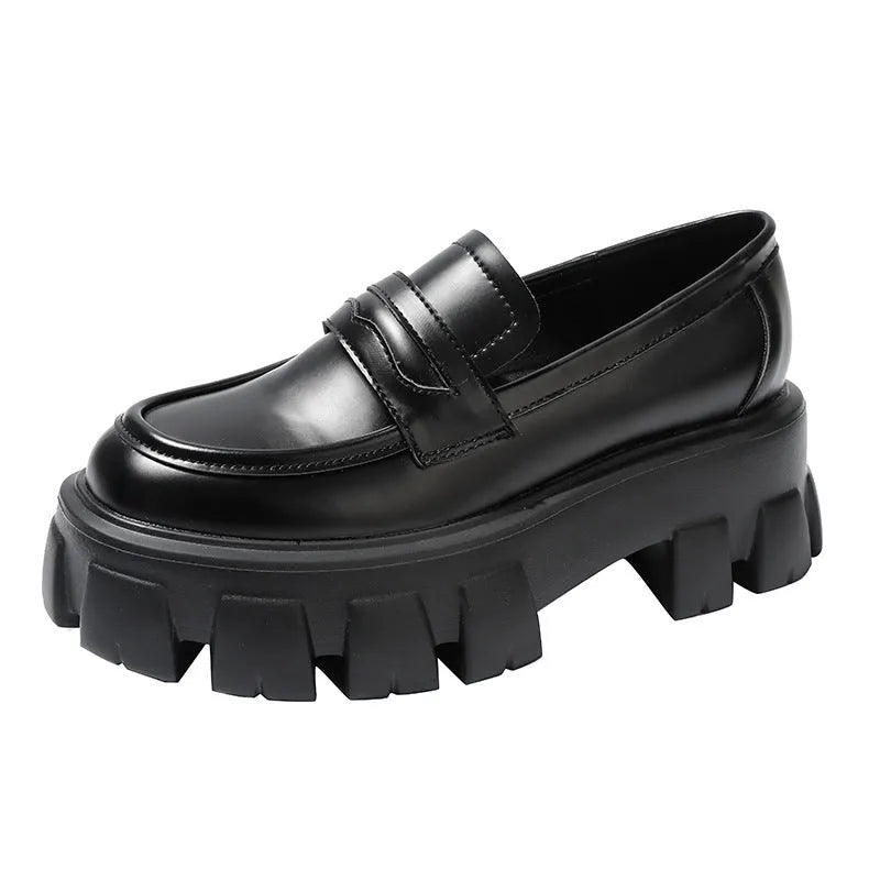 A pair of British style wide fit loafers in patent leather and matte finish options.