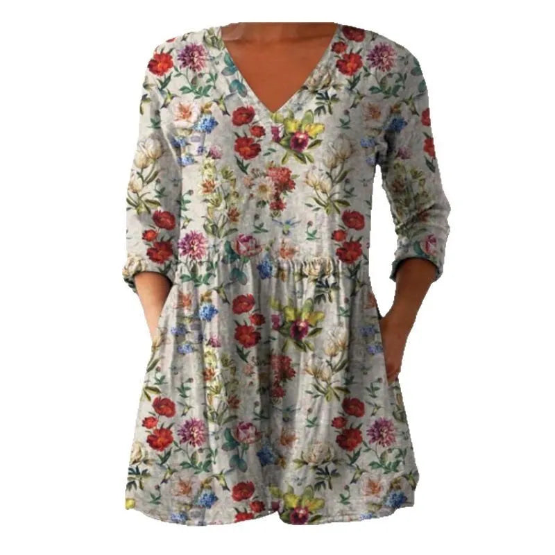 Women's loose-fitting dress with a blue wave print pattern, wide waist, and three-quarter length sleeves.