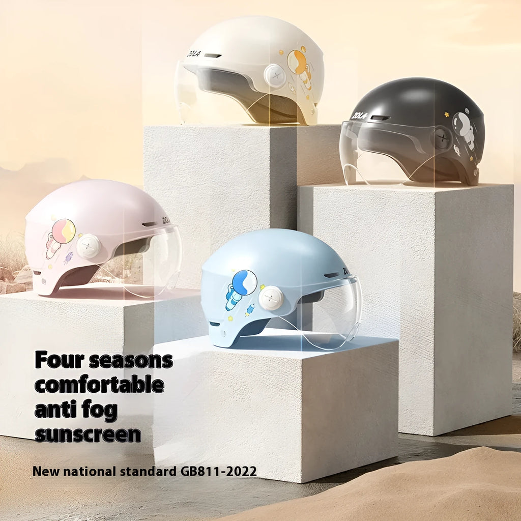 Khaki-coloured electric motorcycle half helmet with attached long glasses on a grey background.