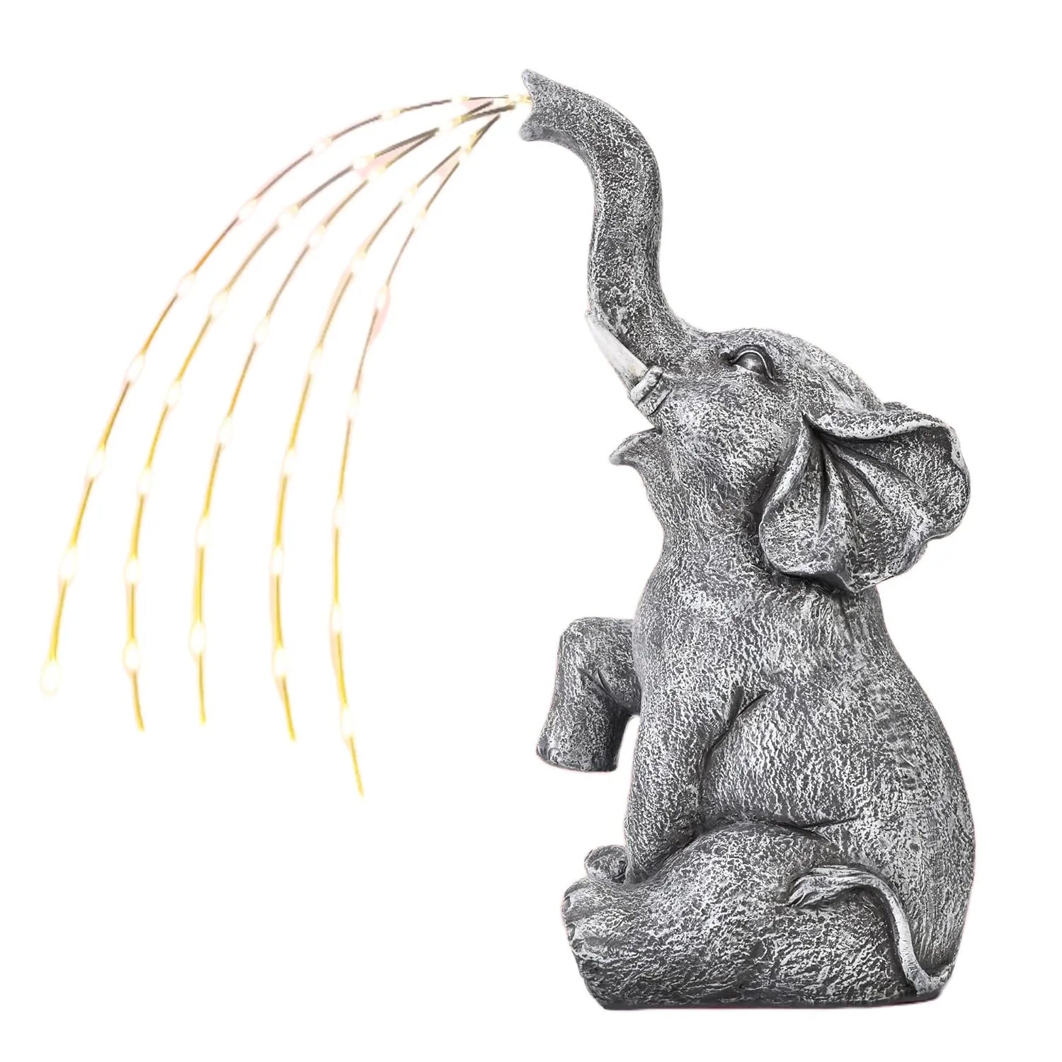 Resin elephant garden statue with built-in LED light strip on grass.
