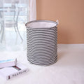 Striped cotton and linen storage basket, 40 x 50cm, with double handles, shown in black or red for laundry, toys or household use.