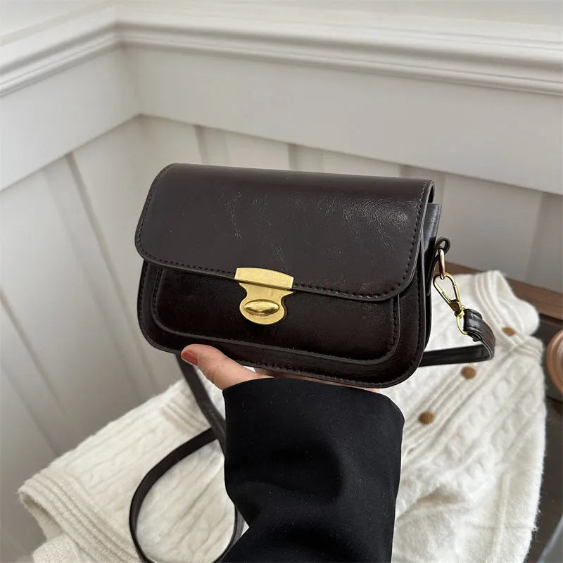 Soft PU leather small square handbag in horizontal rectangular shape showing black colour option