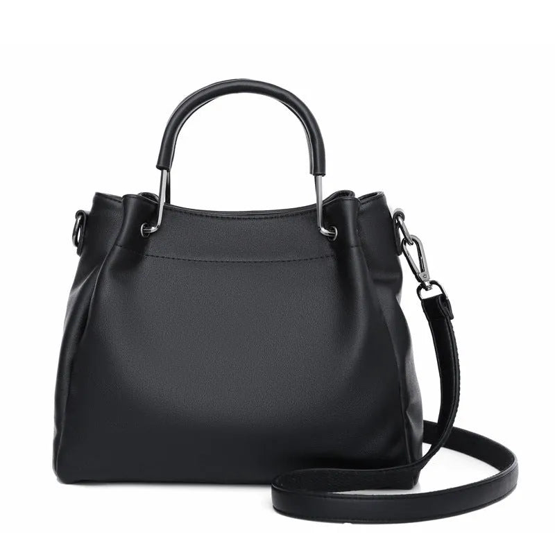 Soft PU leather bucket bag in black with visible sewing thread and external slit pocket