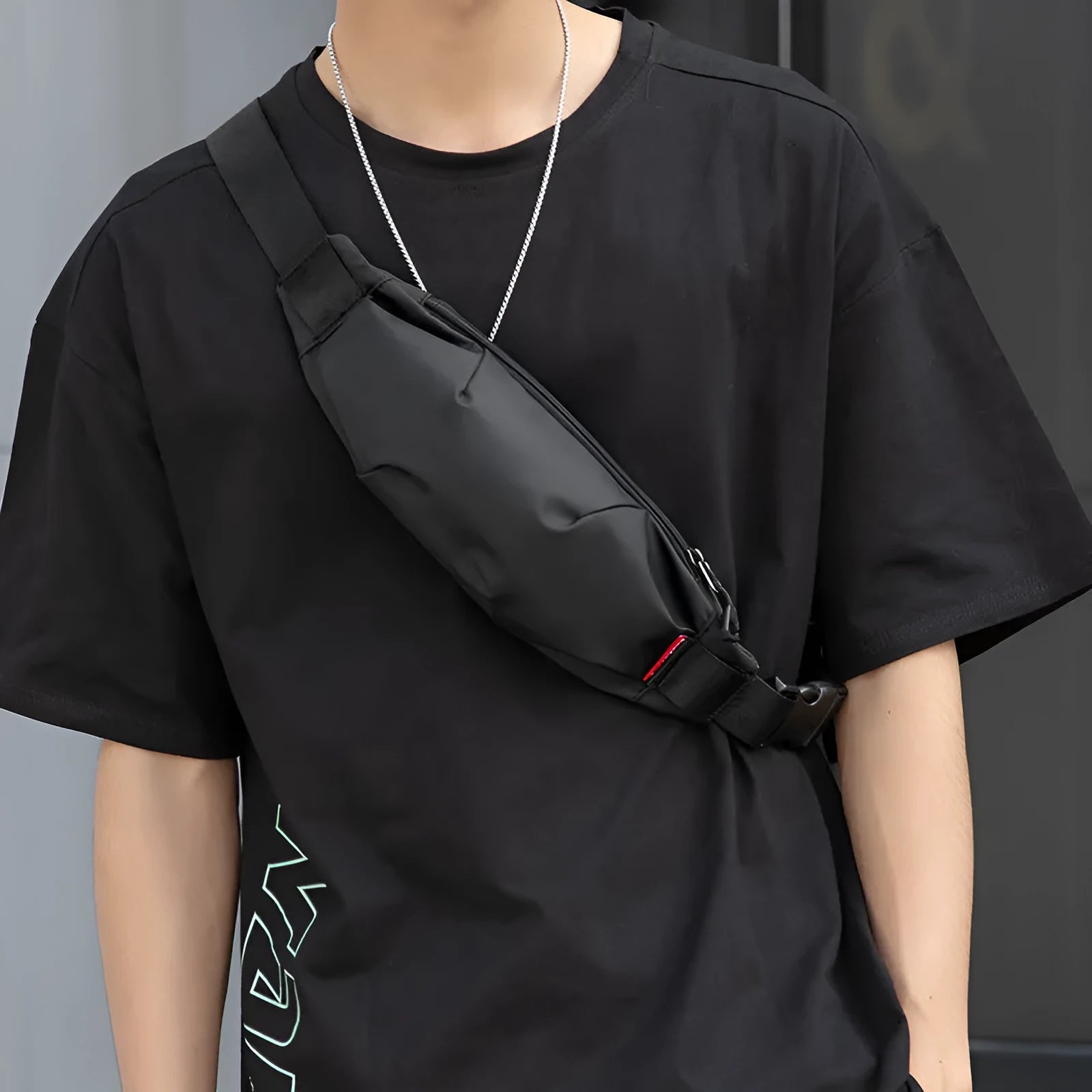 Black Oxford cloth crossbody waist pack with zip closure, shown with internal phone and ID pockets visible.