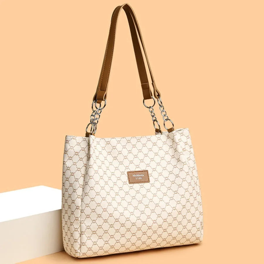 A brown retro-style women's PU leather handbag with a single strap and polyester lining.