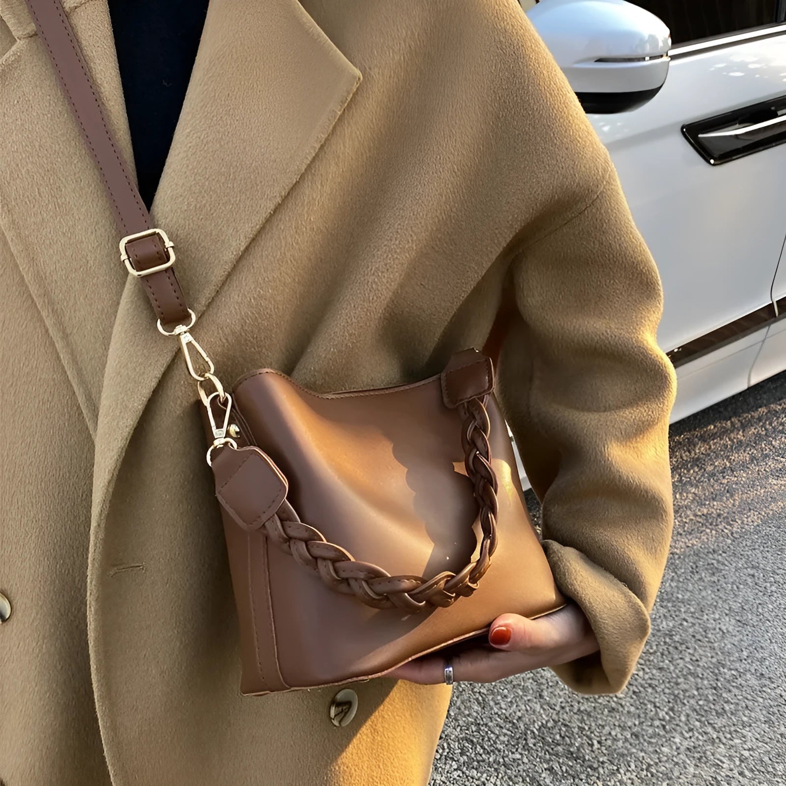 Retro khaki PU leather crossbody bucket bag with woven detail and a brown strap.