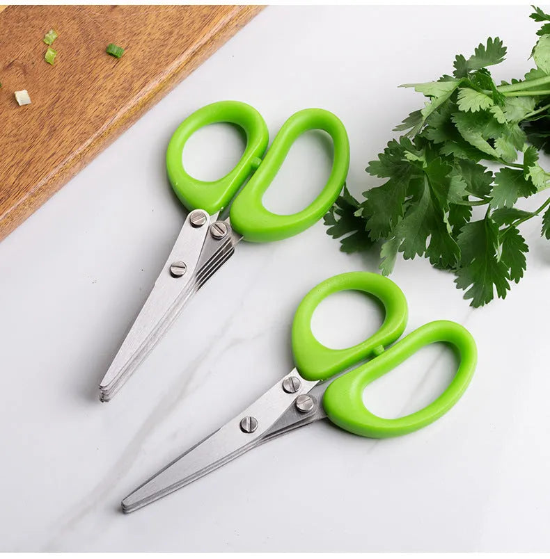 Green multi-layer stainless steel kitchen scissors for cutting herbs and green onions.