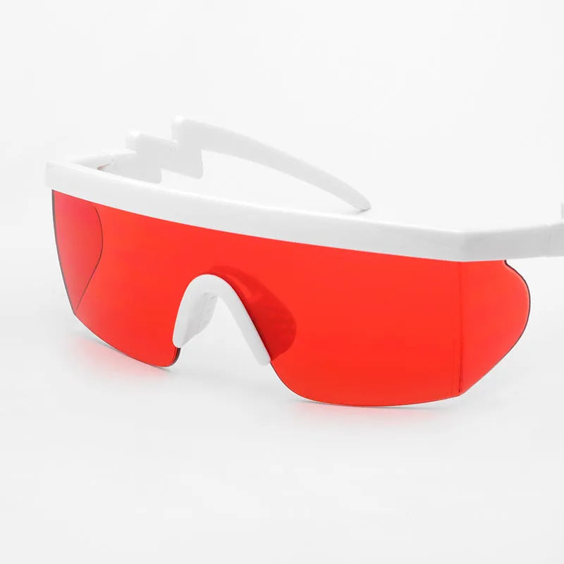 Sports sunglasses with half-frame PC construction and colourful lenses on a white background.