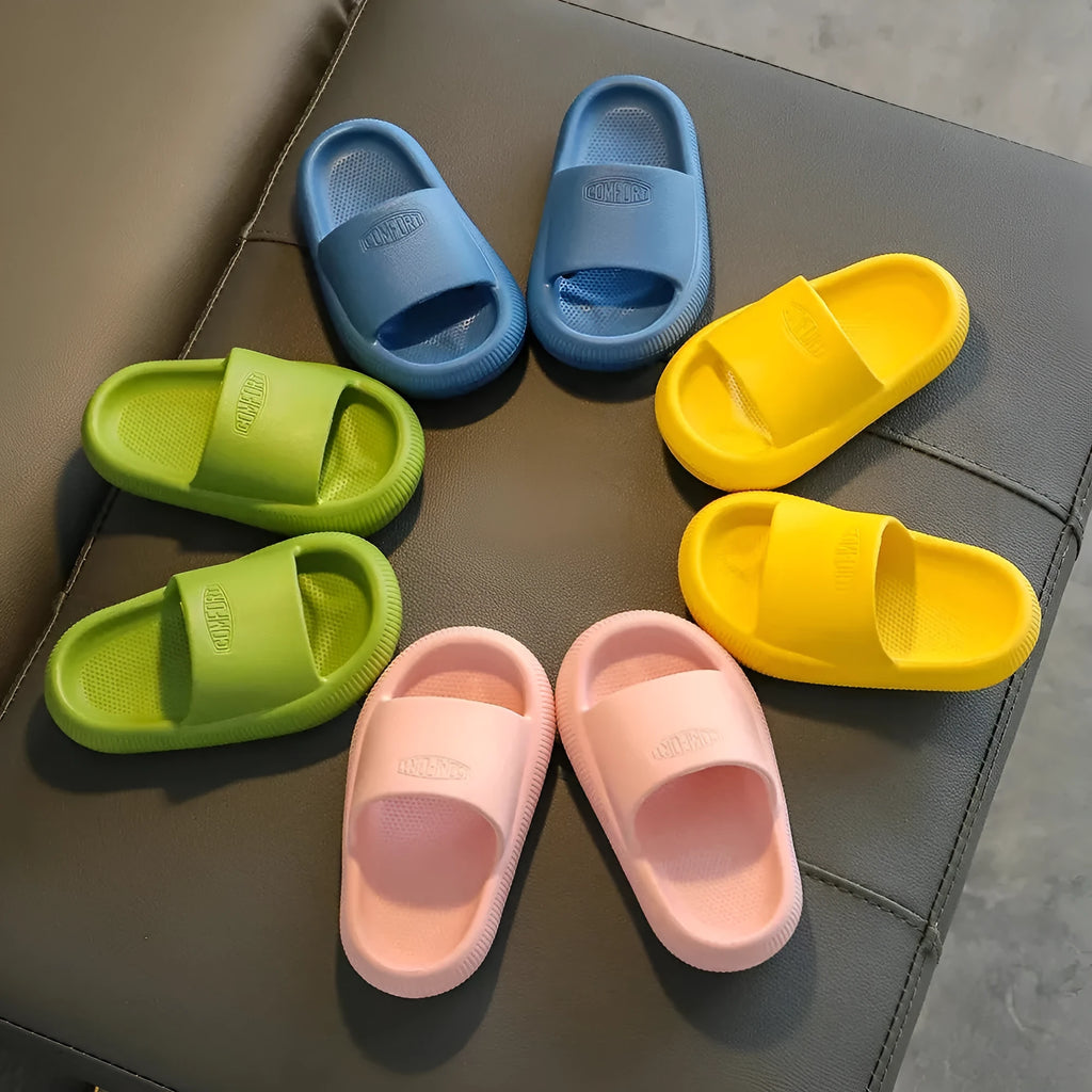 Children's colourful EVA slippers with a non-slip sole on a white background.