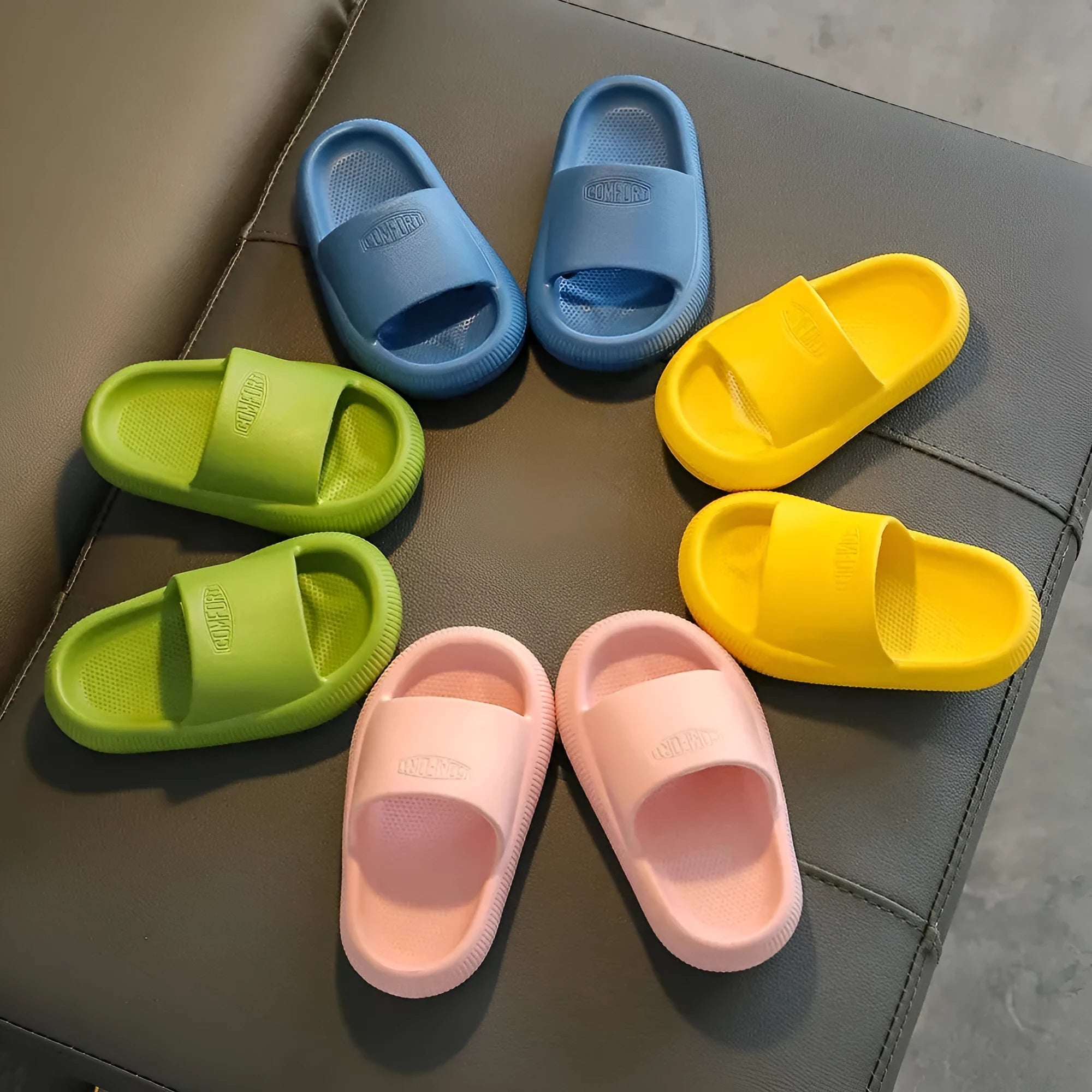 Children's colourful EVA slippers with a non-slip sole on a white background.