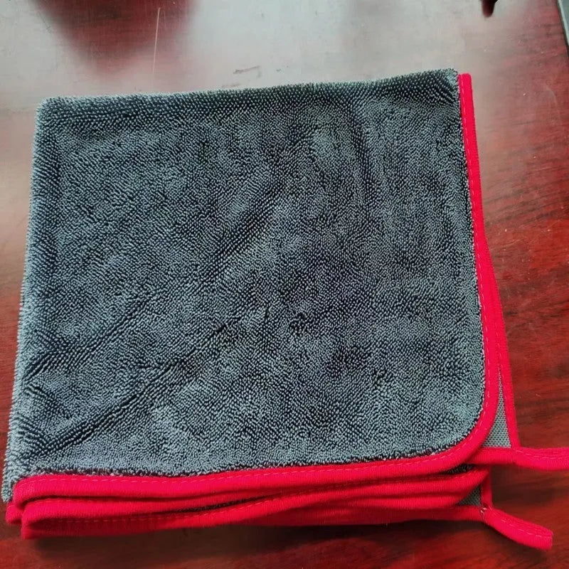 Grey braided twisted car cleaning towel shown in a large size next to a smaller size option.