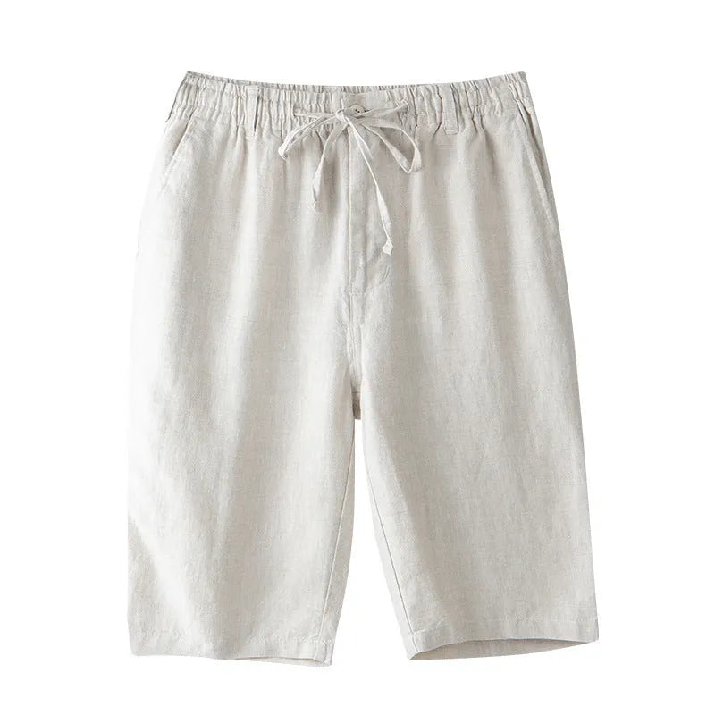 Men's loose-fitting linen capri pants in a light colour, showing the straight-leg style.