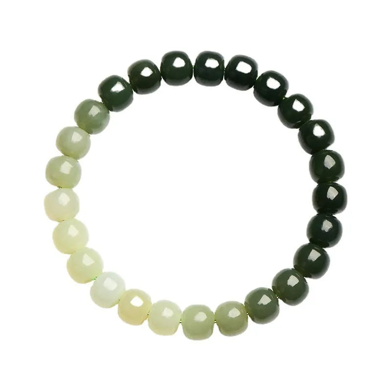 Natural Hetian jade water gradient bracelet with polished beads on a wrist.