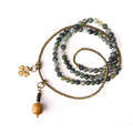 Handmade multi-layered ethnic style children's bracelet in natural crystal or stone, shown in sizes for boys and girls.