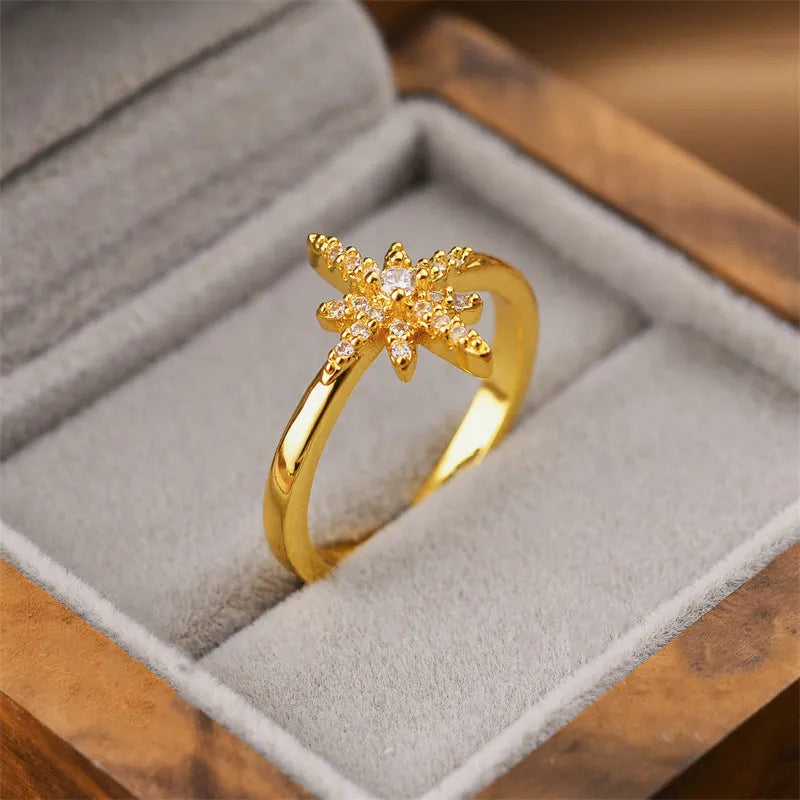 Gold geometric open design women's ring made from electroplated copper, showing one of five available style variations.