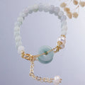 Women's Korean style crystal bracelet showing options with jade pendant or coloured stone safety buckle.