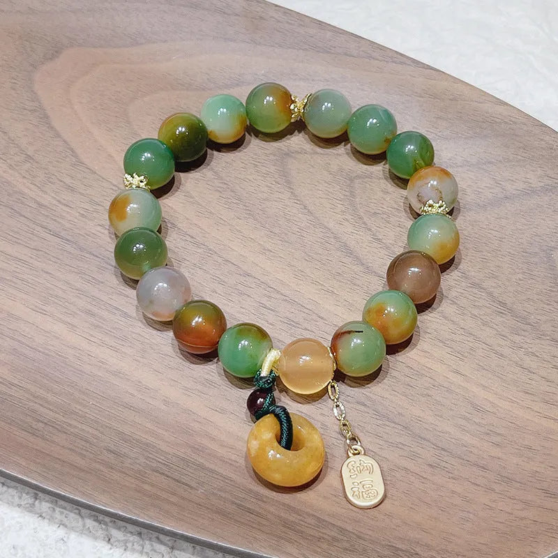 Yellow peacock agate women's bracelet with peace buckle closure measuring 1cm wide