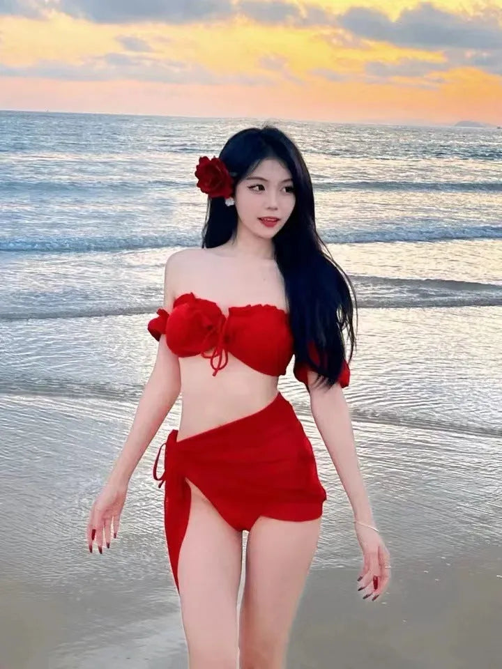Red women's bikini swimsuit with puff sleeve skirt top and solid colour briefs