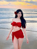 Red women's bikini swimsuit with puff sleeve skirt top and solid colour briefs