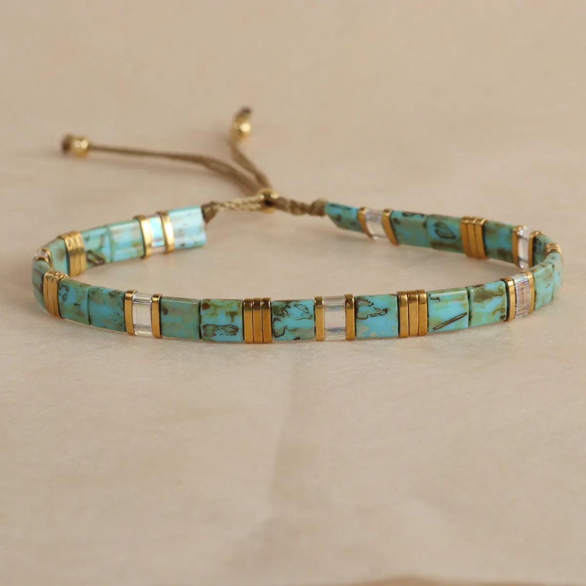 Geometric pull bead bracelet with round glass beads in five colour options