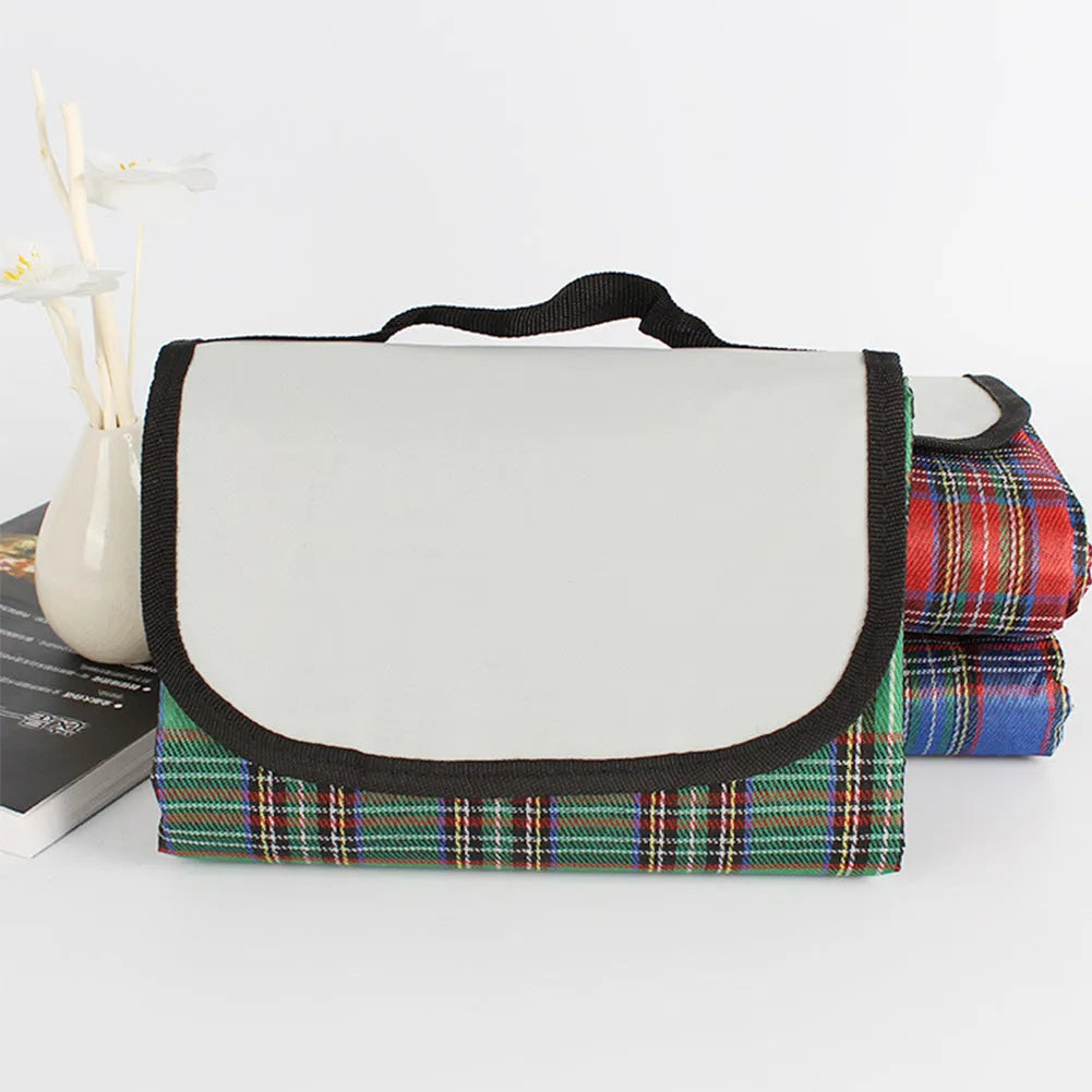 Waterproof acrylic picnic mat in green, red, or blue plaid, 150 x 100cm, with one cushion