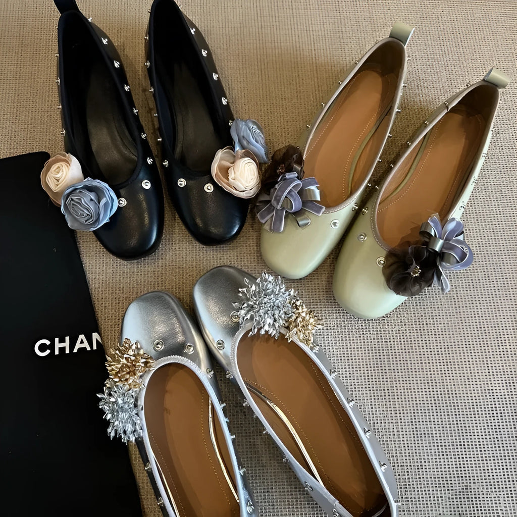 Women's silver Mary Jane flat shoes with a buckle strap and sheepskin upper.