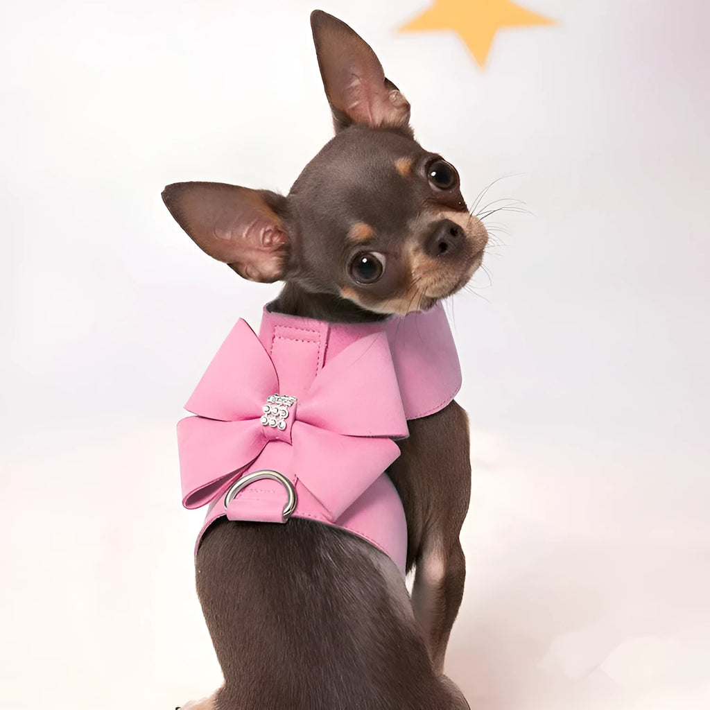 Cute pink puppy harness with a bowknot, made from soft microfiber, shown on a small dog.