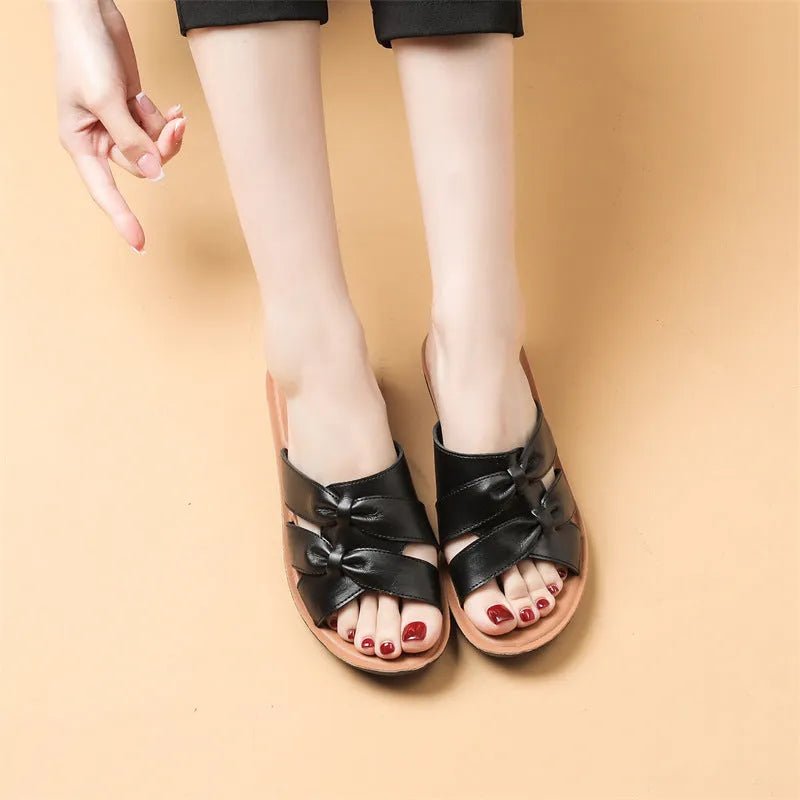 Women's cowhide slippers in beige, black, or red colours with non-slip soles and imitation leather lining