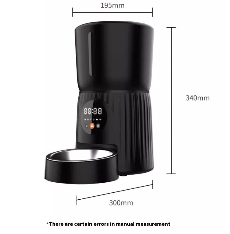 Black automatic pet feeder with digital display and detachable bowl on a kitchen floor.