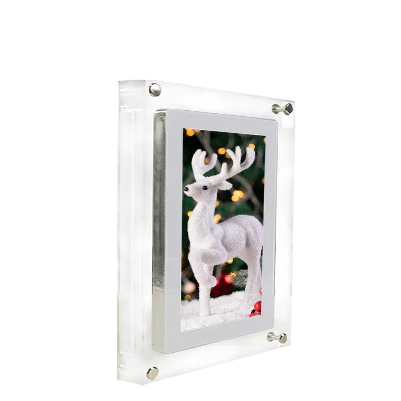 White vertical digital photo frame with 5-inch screen showing family photographs