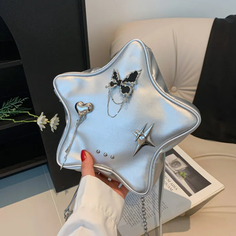 Black women's PU backpack with metal butterfly pendant, chain strap, and an outer 3D pocket.