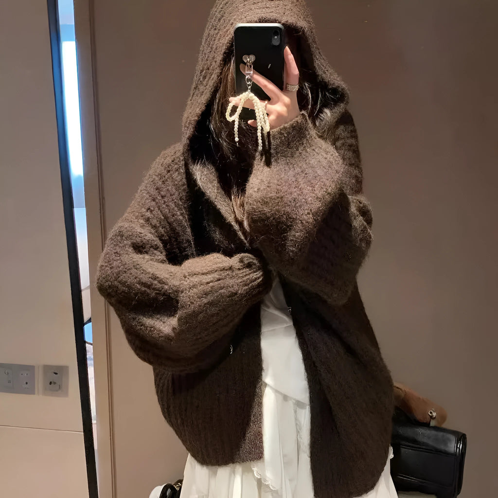 Woman wearing a dark grey retro knit Maillard pattern hooded cardigan