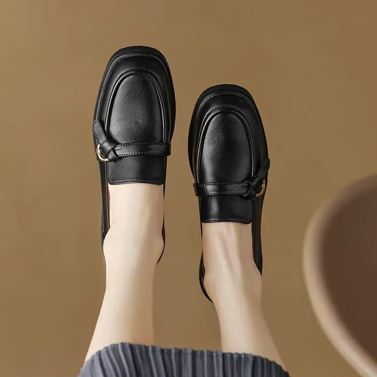 Round toe low heel slip-on women's shoes with metal and sequin details in black, side view
