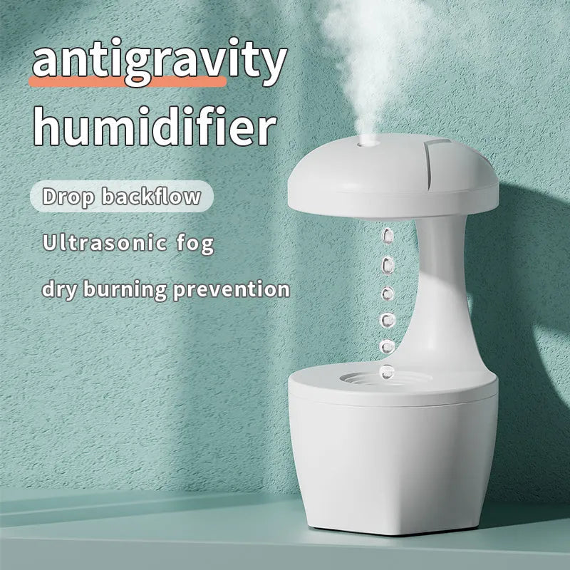 Portable white anti gravity USB cool mist humidifier with 800ml tank and droplet effect on a desk